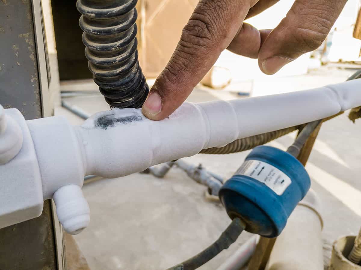 How can I fix an air conditioner's frozen pipe?